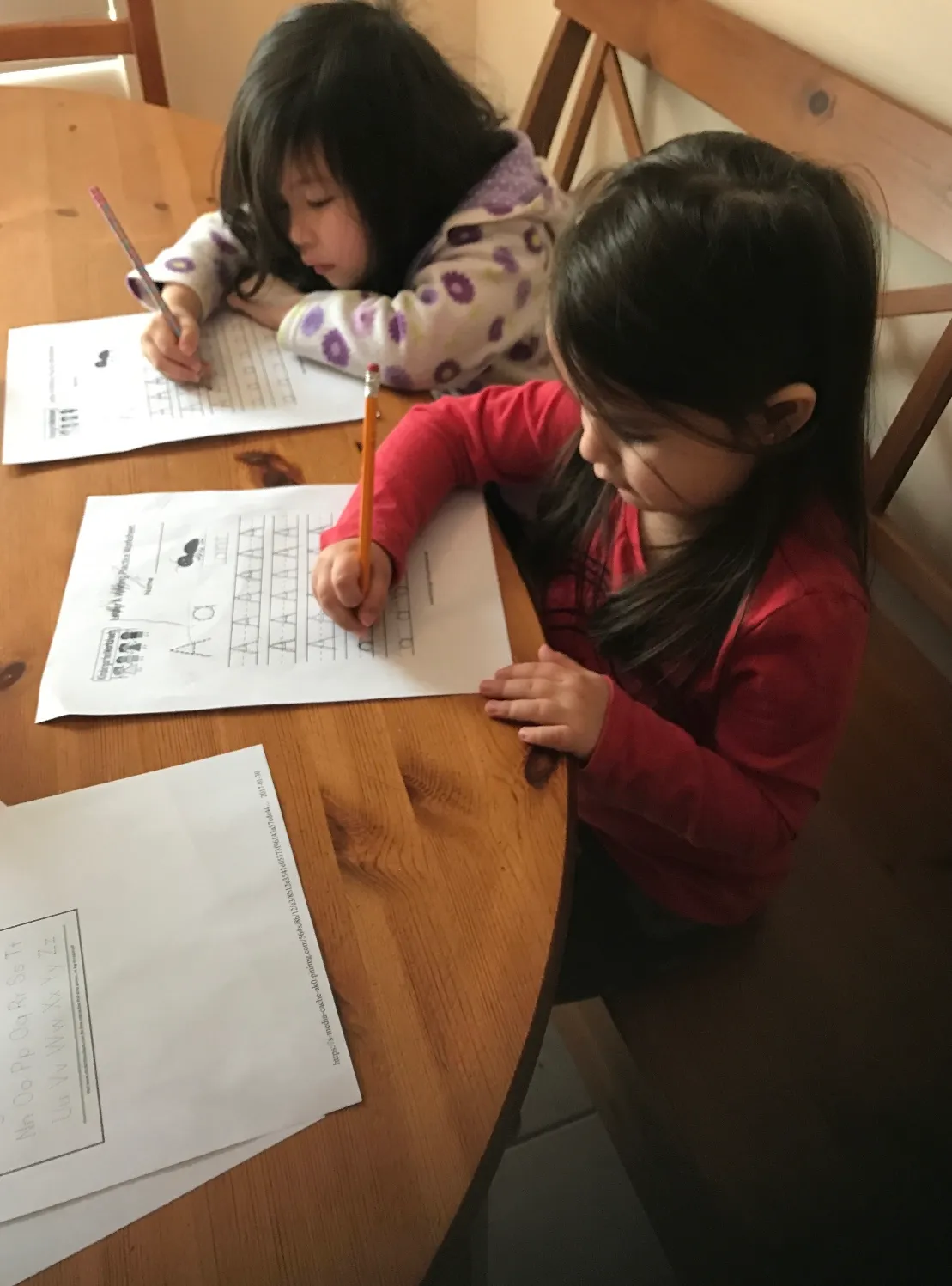 Photo of daycare kids practicing their penmanship